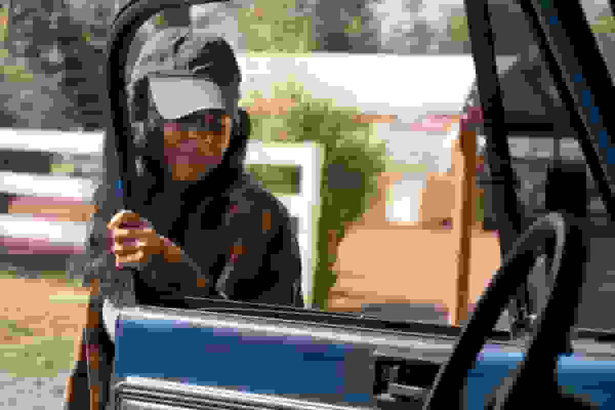 A small business owner reviewing commercial auto insurance options to make informed decisions and debunk common misconceptions about coverage.