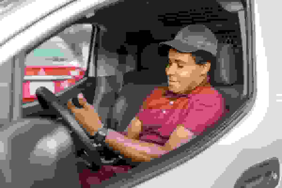 Small business owner reviewing commercial auto insurance options.